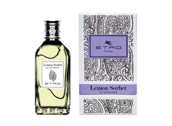 Frasco de perfume con tapón plateado y caja decorada con paisley