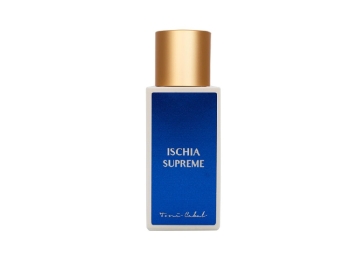 Frasco de perfume blanco con etiqueta azul y tapón dorado Toni Cabal Ischia Supreme